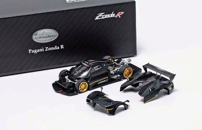 Pagani Zonda R scale model car kit with a black body, gold wheels, and matching rear wing and front splitter parts, by Almost Real & Motorhelix 