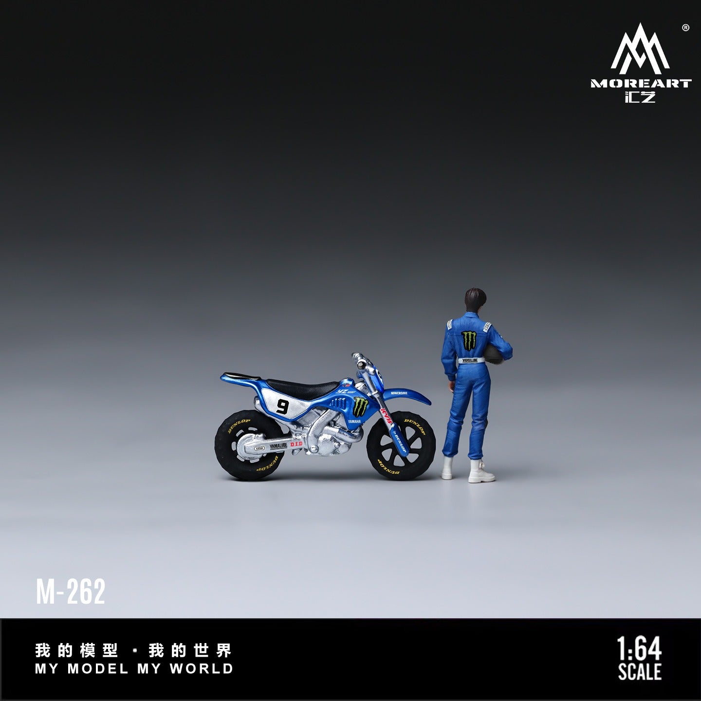 A 1:64 scale model kit showing a blue and white racing dirt bike next to a small figure of a racer in a blue racing suit. The image is branded with the 'MOREART EZ' logo in the top right and features a black banner at the bottom with model number 'M-262' and Chinese text.