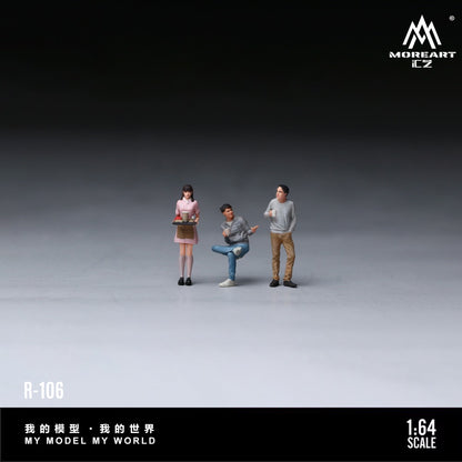 Three miniature human figures posed on a dark-to-light gray studio gradient background. The figures appear to be a small-scale collectible model set, with printed branding visible in the corners: MORHEART EZ at top right and R-106 